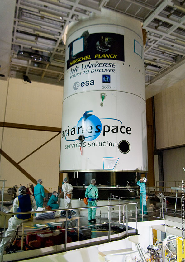Fairing almost in place showing the mission logos Fairing almost in place showing the mission logos